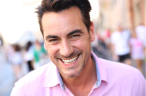 Closeup of handsome guy wearing pink shirt