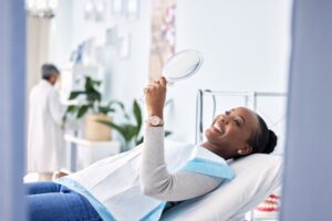 Smile,,Mirror,And,Black,Woman,At,Dentist,On,Chair,In